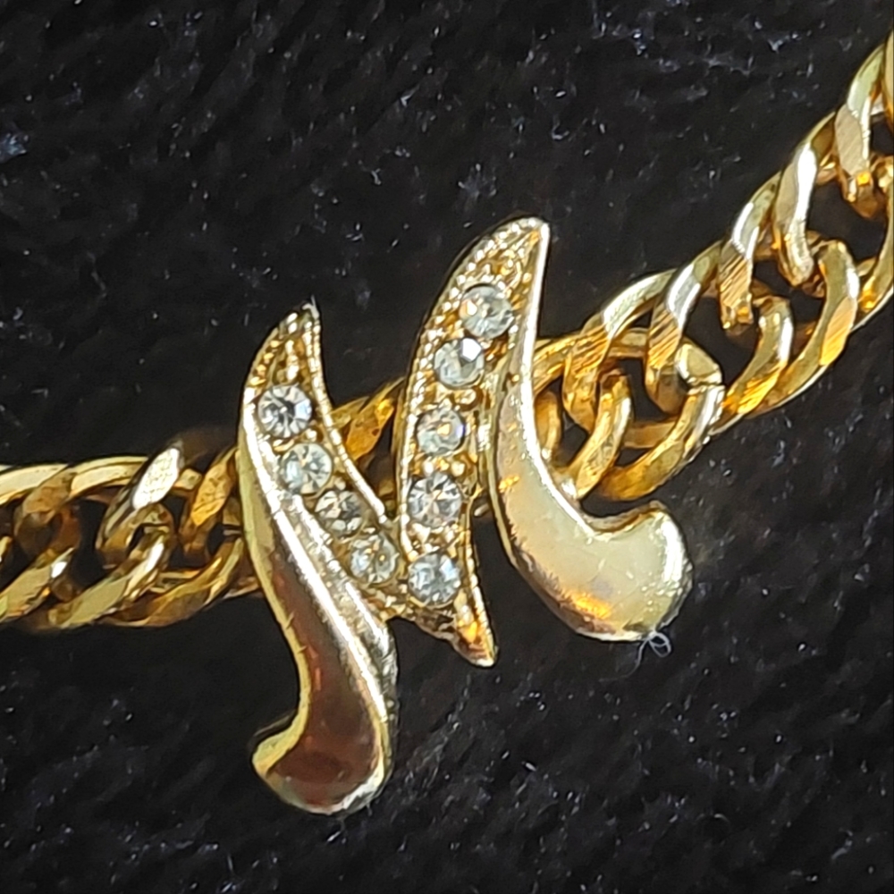 Gold tone monogram bracelet
